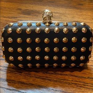 Black skull clutch with gold hardware